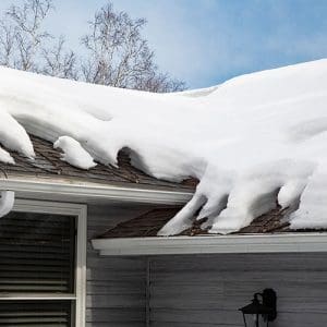 Roof de-icing heating cable system on roof in Winter