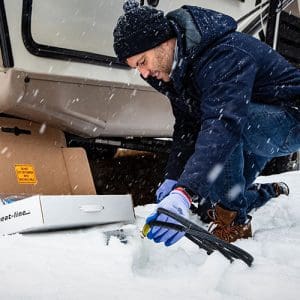 Contractor holding self-regulating low voltage heat trace system to install in RV